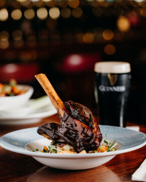 image of lamb leg and a pint of Guinness