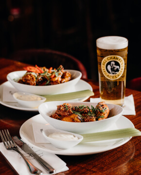 image of chicken wings and a beer