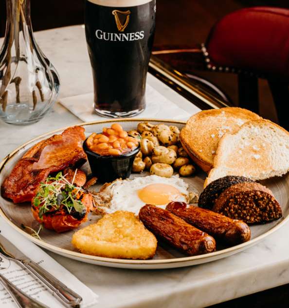 image of full irish breakfast and a pint of Guinness